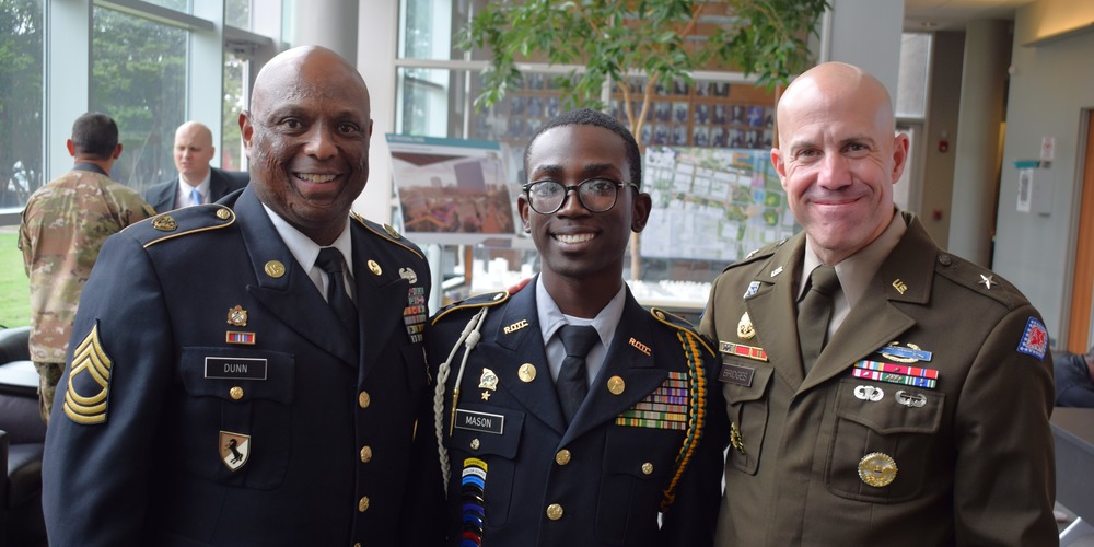 three men in military uniform smiling