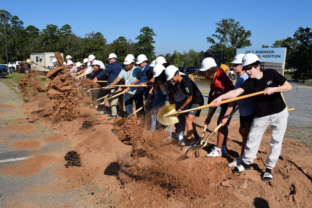 students picked up shovels with Principal Laconya Isaac, Superintendent Jeff Senn, School Board Vice President Dr. Laurel "Laurie" Tait, and other district officials to break ground on the Joe T. Robinson student expansion