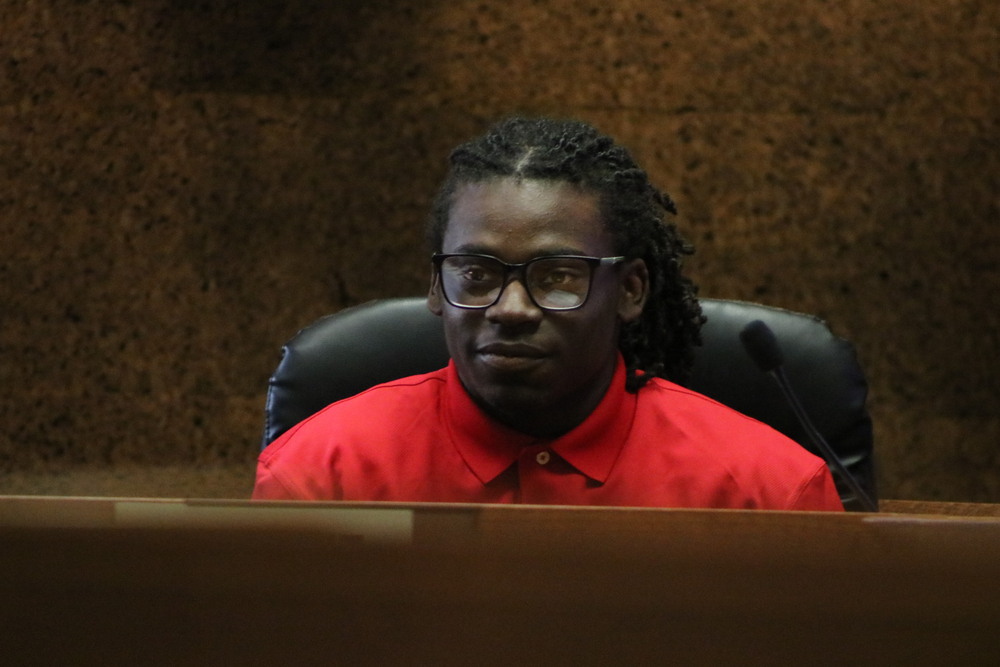 Student board member seated at a board meeting