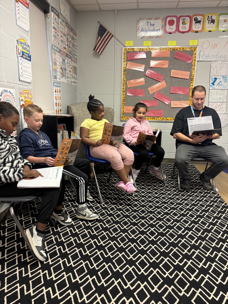 Mr. Smith and students in Group Two performing The Earth Shapers. 