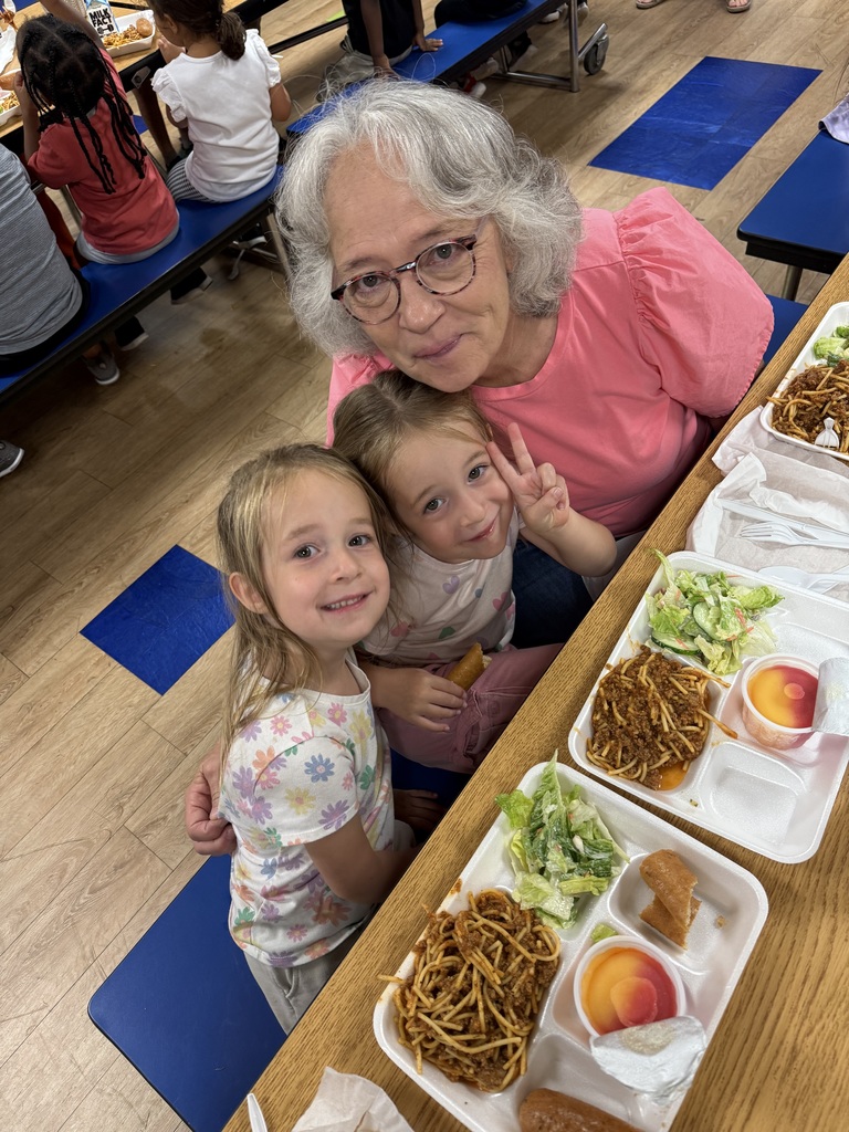 Image of twin students with their grandmother