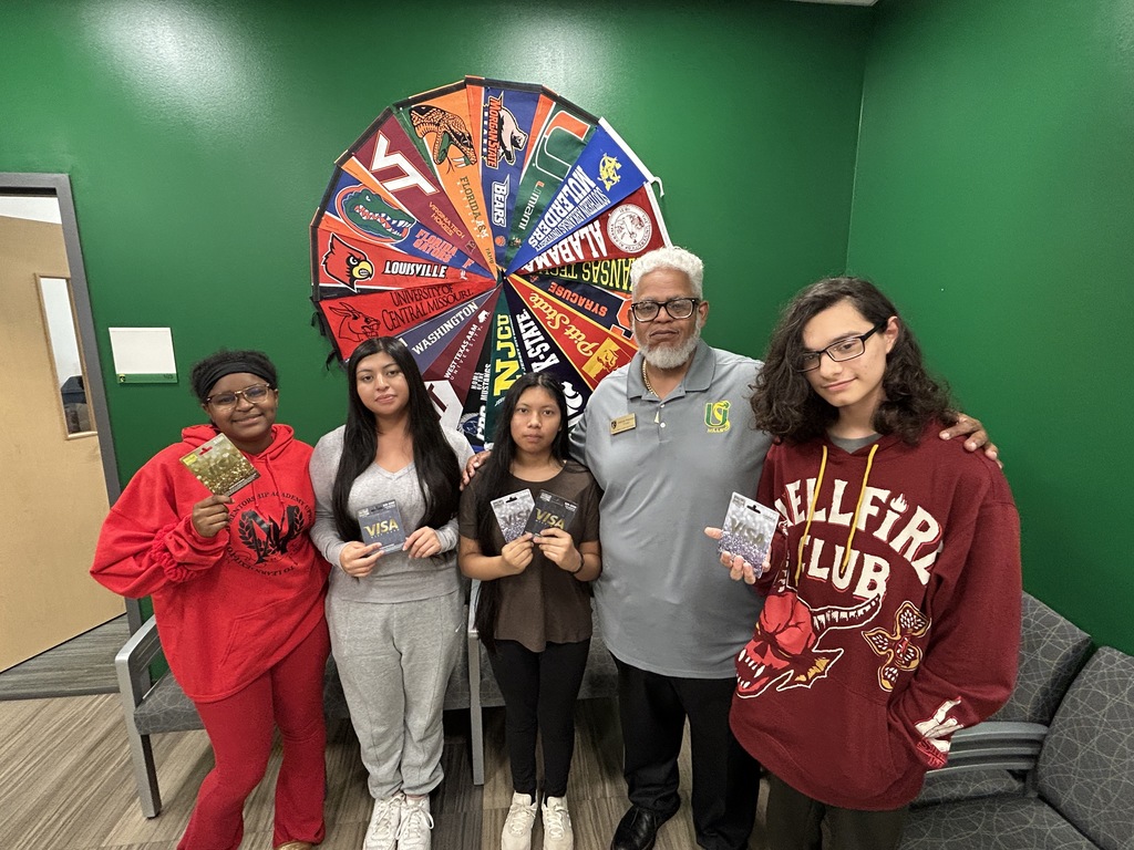 Principal and students in office