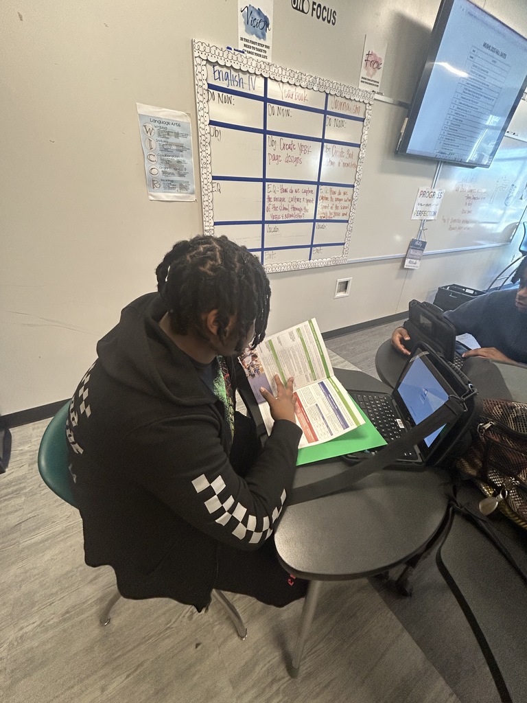Senior looking at graduation materials