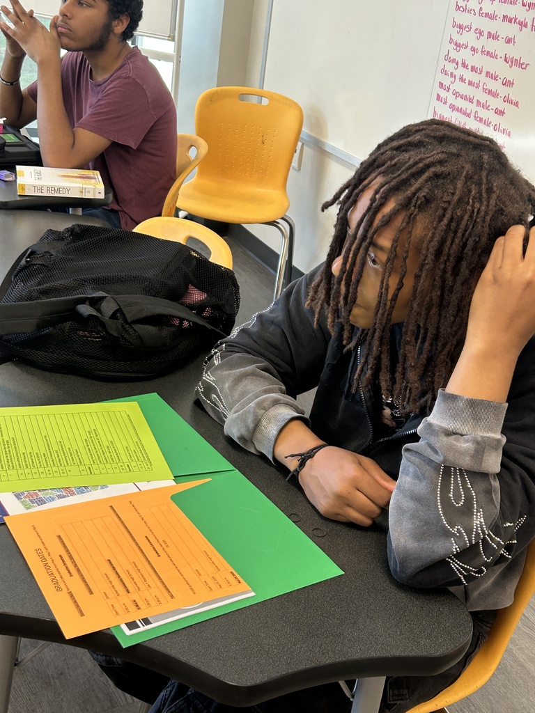 Senior looking at folder of materials