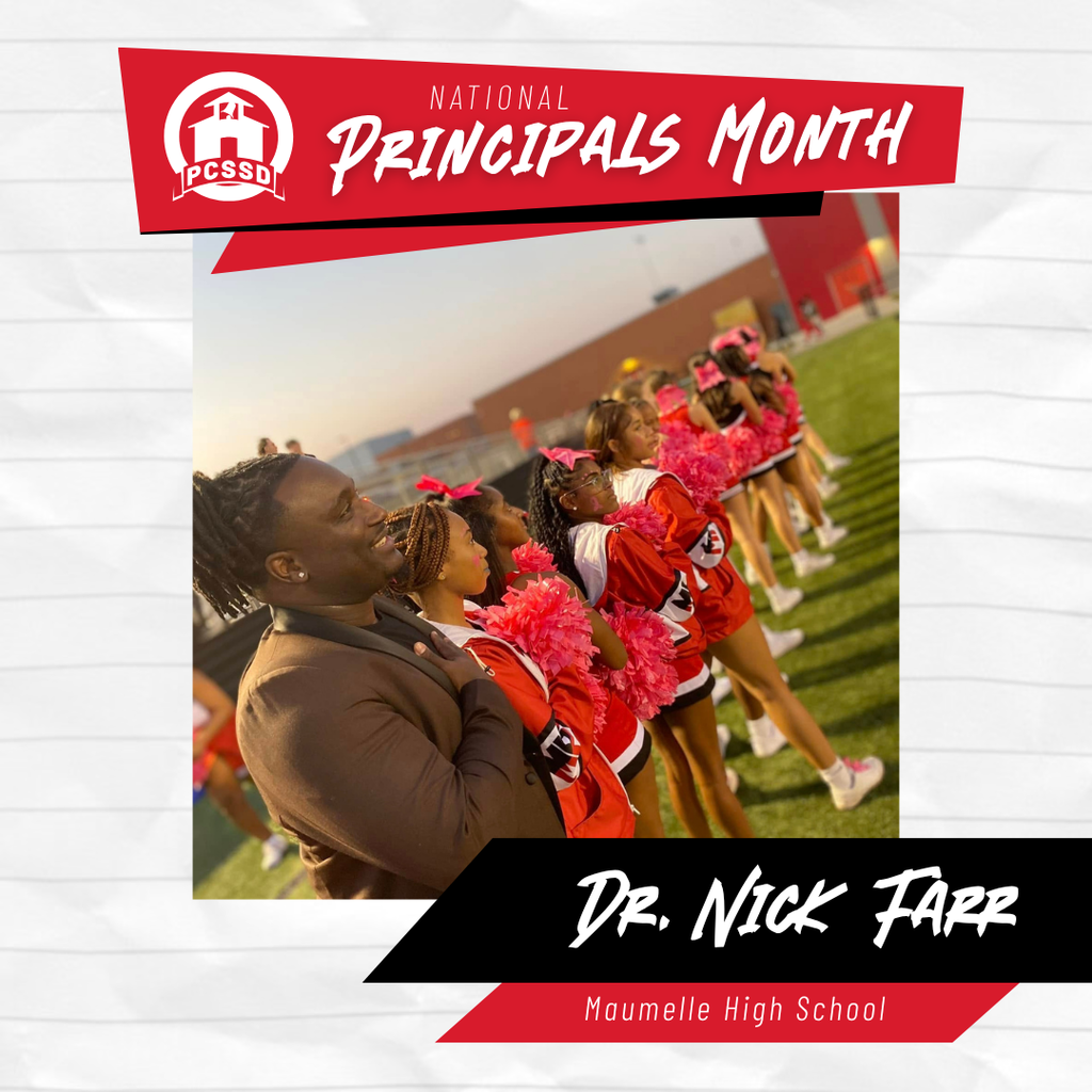photo of Principal Farr standing with cheerleaders on the football field