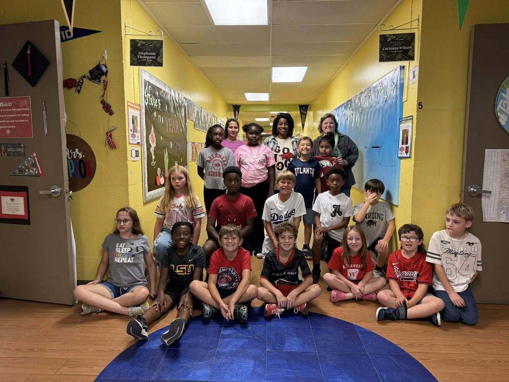 Group of students wearing college shirts for AVID Day Sherwood Elementary School