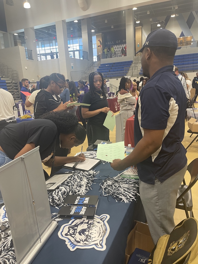 Students speaking with college admissions counselor