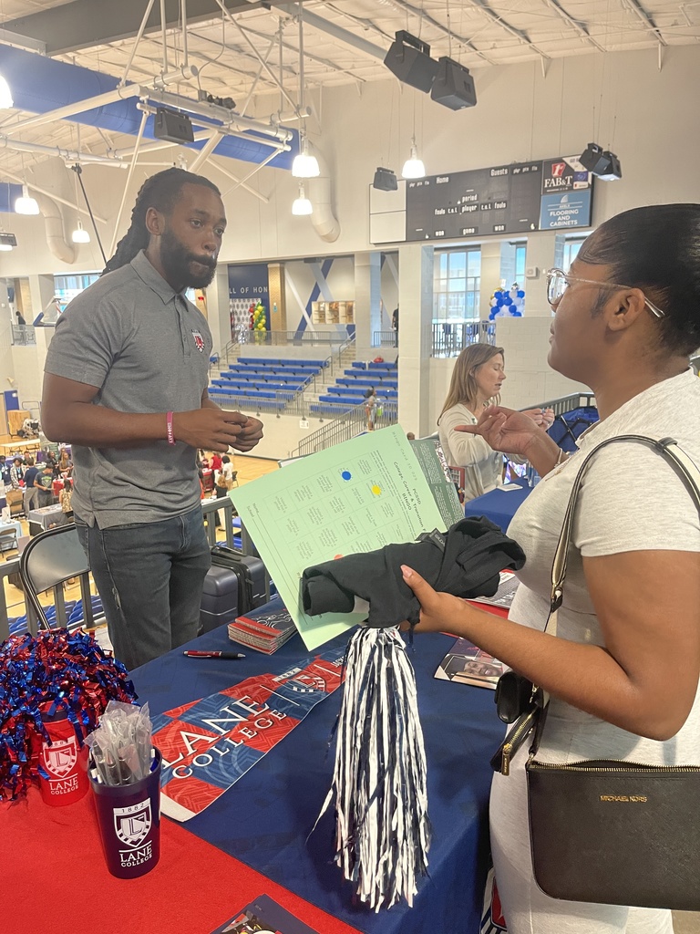 Student at college fair table