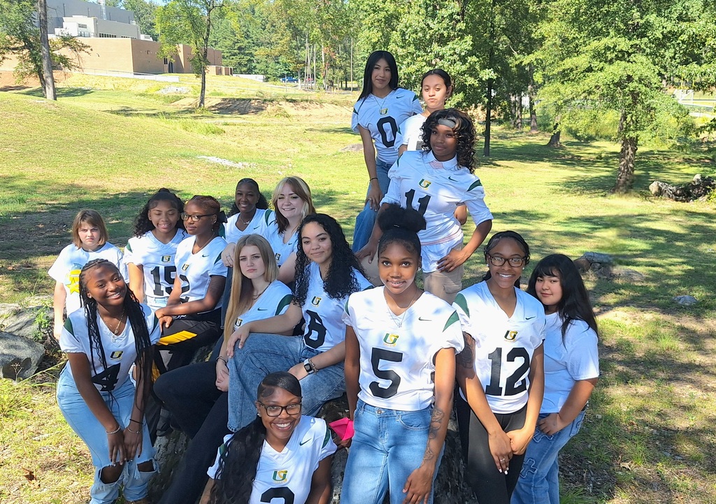 Mills University Studies High School Homecoming Court standing in a field