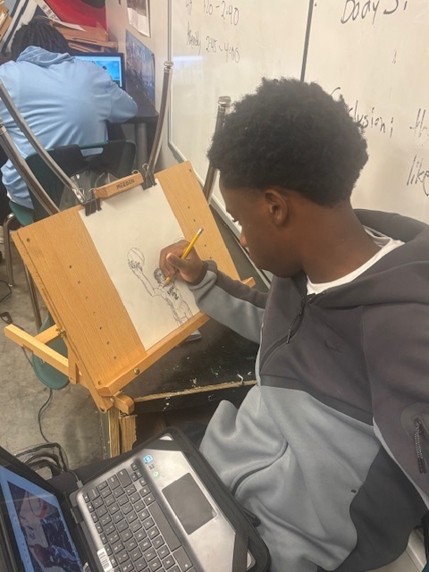 Student sketching a basketball player