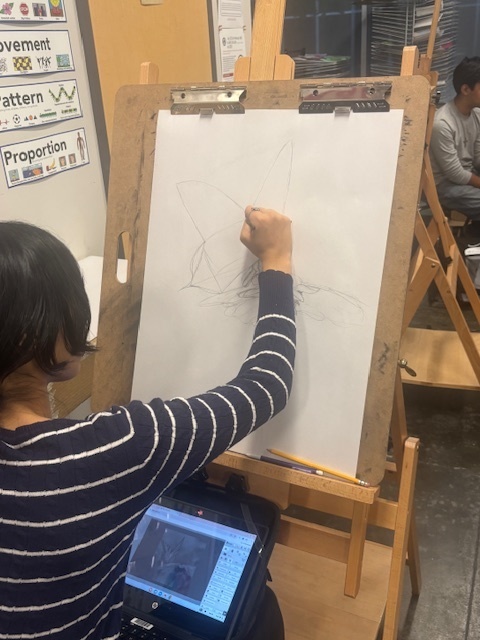 Student sketching in art class