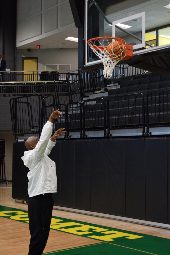 Coach Cooper making the first basket in the new arena.