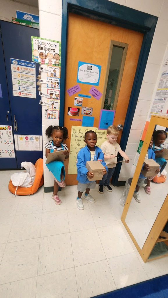 Daisy Bates students pretend to be postal workers on AVID ROCK YOUR SCHOOL DAY