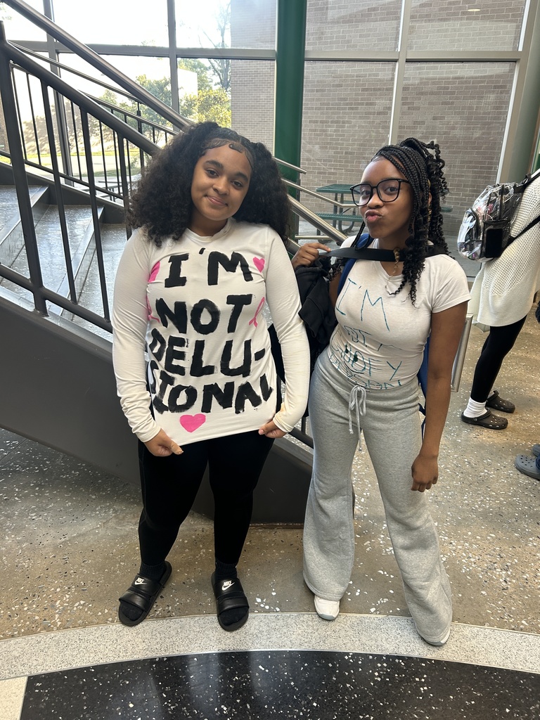 Students with messages on their white t-shirts