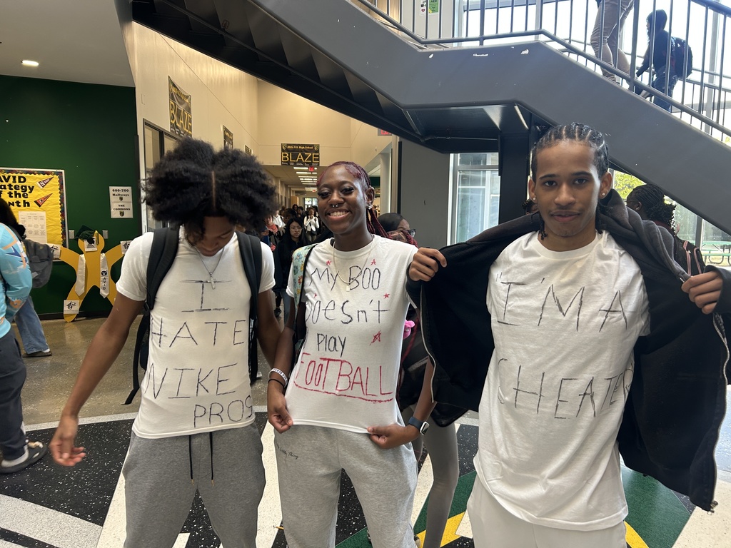 Students in white t-shirts with messages