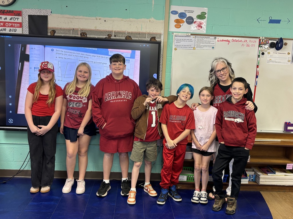 Fourth Graders and their teacher in college shirts/jerseys to show that we are educating ourselves on a drug free lifestyle.