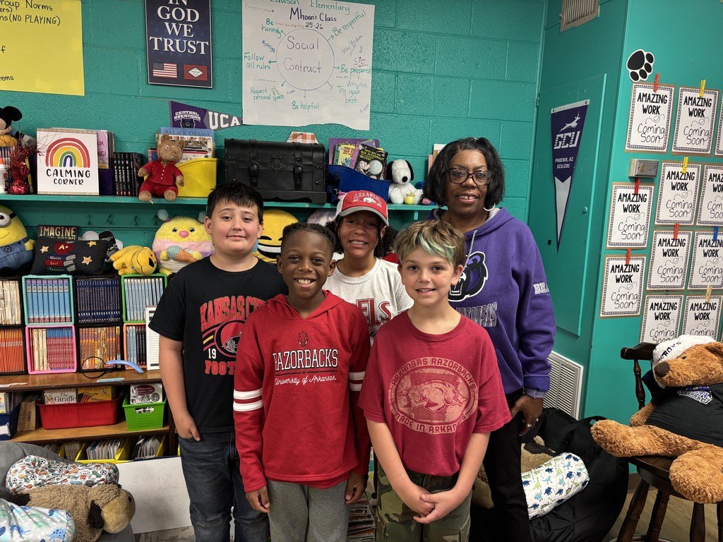 Fourth Graders and their teacher in college shirts/jerseys to show that we are educating ourselves on a drug free lifestyle.