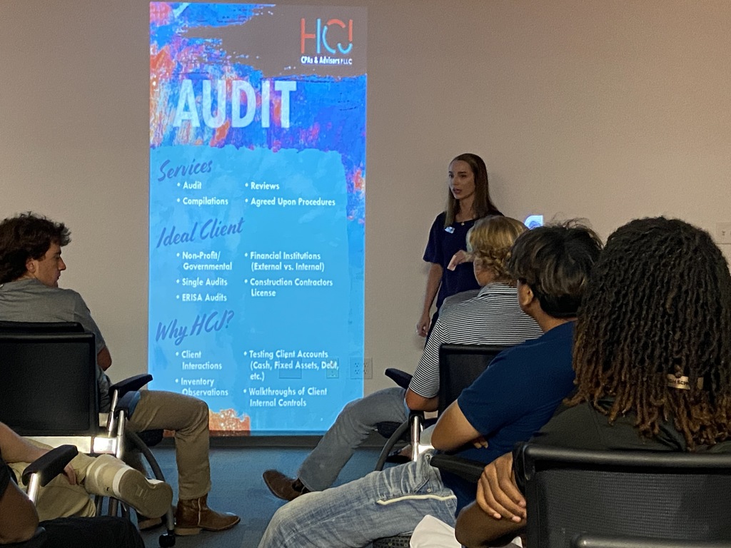 Bringing classroom concepts to life! RHS  students review an audit slide at HCJ CPAs & Advisors.