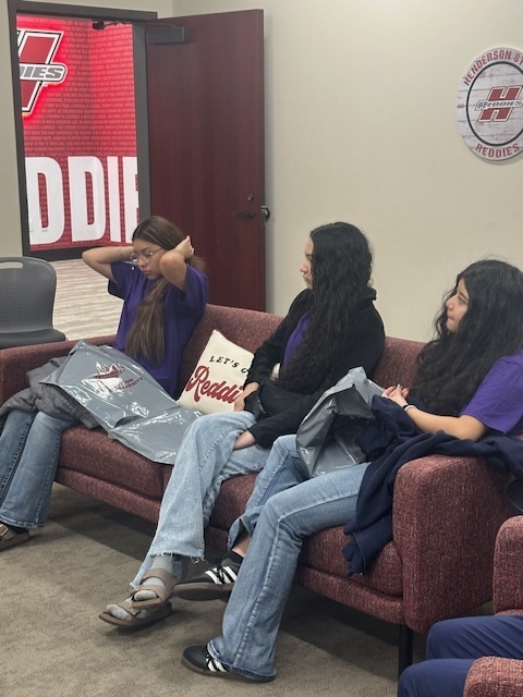 Students on college visit - sitting on sofa