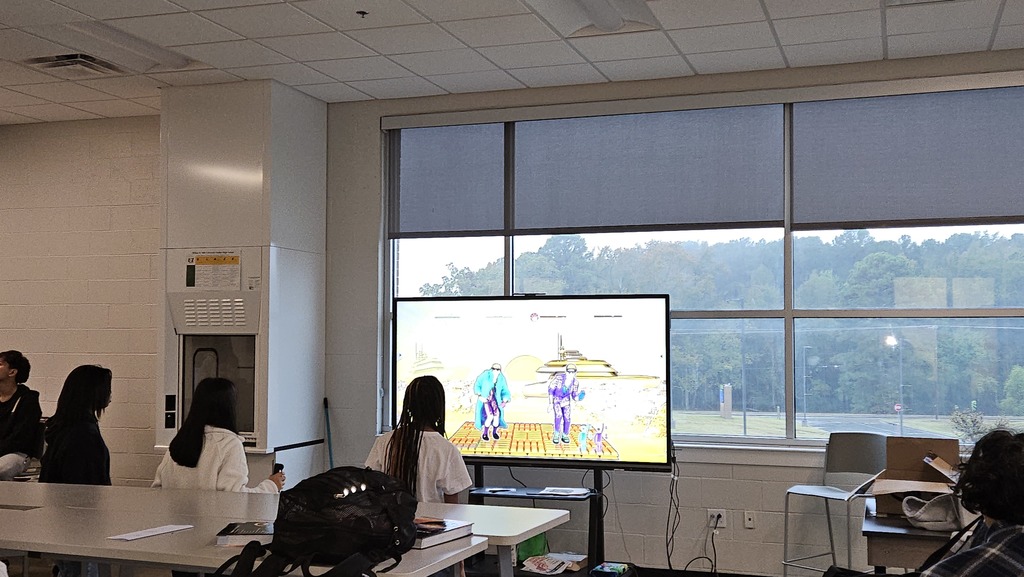 Students playing a dance game on the Wii