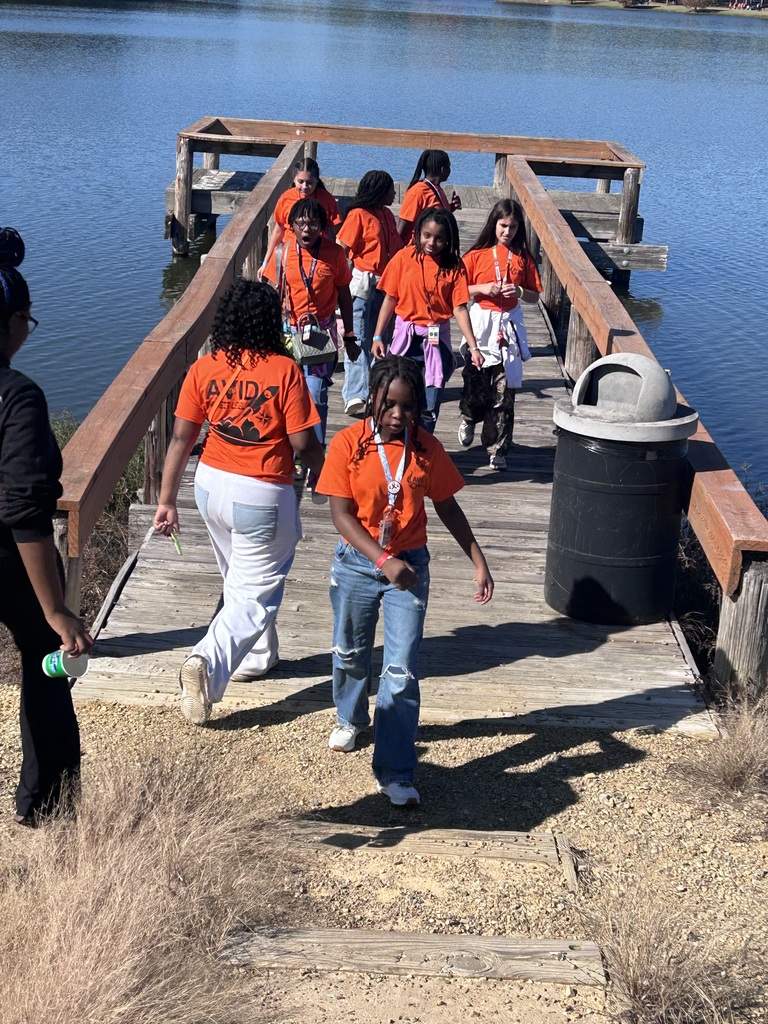 Picture of Mills Middle School AVID scholars walking from wood pier at Lake Willastein Park