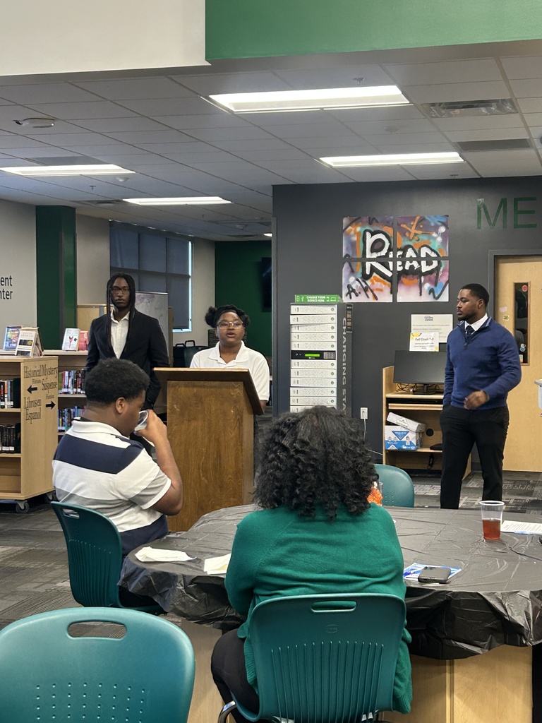 Student speaking behind lectern