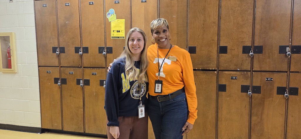 Hallway spirit! Principal Isaac chats with Ms. Farhat in between classes.
