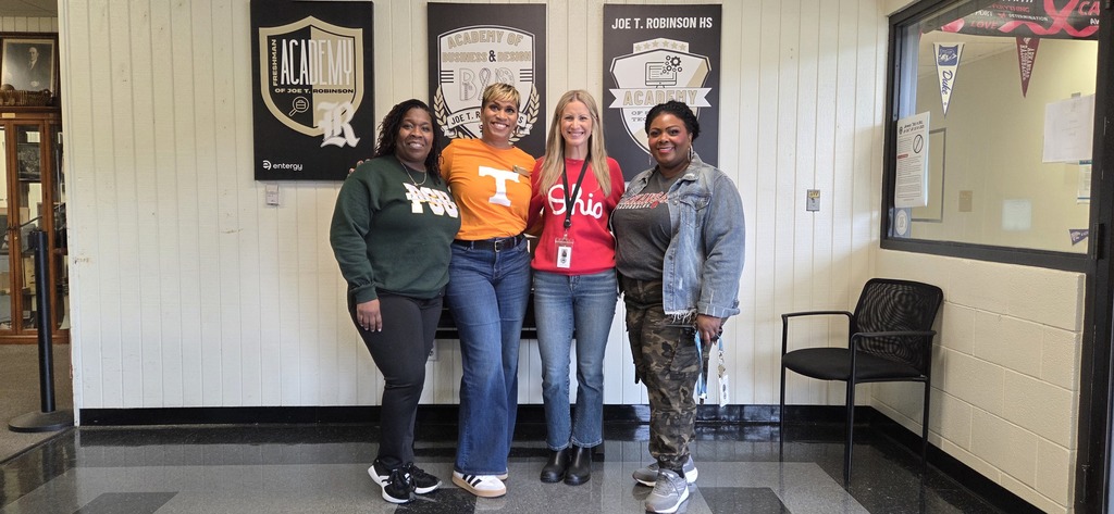 RHS Leadership leading the way — (pictured left to right) Director of Special Education Mrs. Washington, Principal Isaac, Yearbook Teacher Mrs. Reissig, and Assistant Principal Dr. Berry proudly rocking their college gear in the front office!