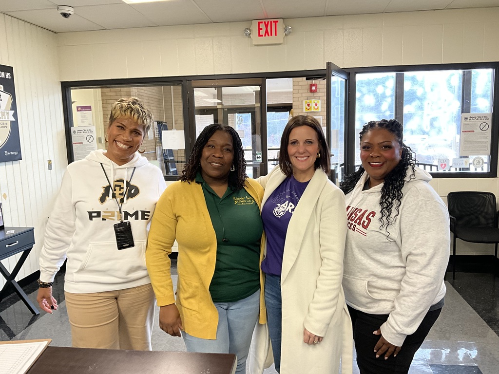 From left to right—Principal Laconya Isaac, Raven Washington, Michelle Camp, and Shavonya Berry showing off their college spirit for AVID College & Career Readiness Day.