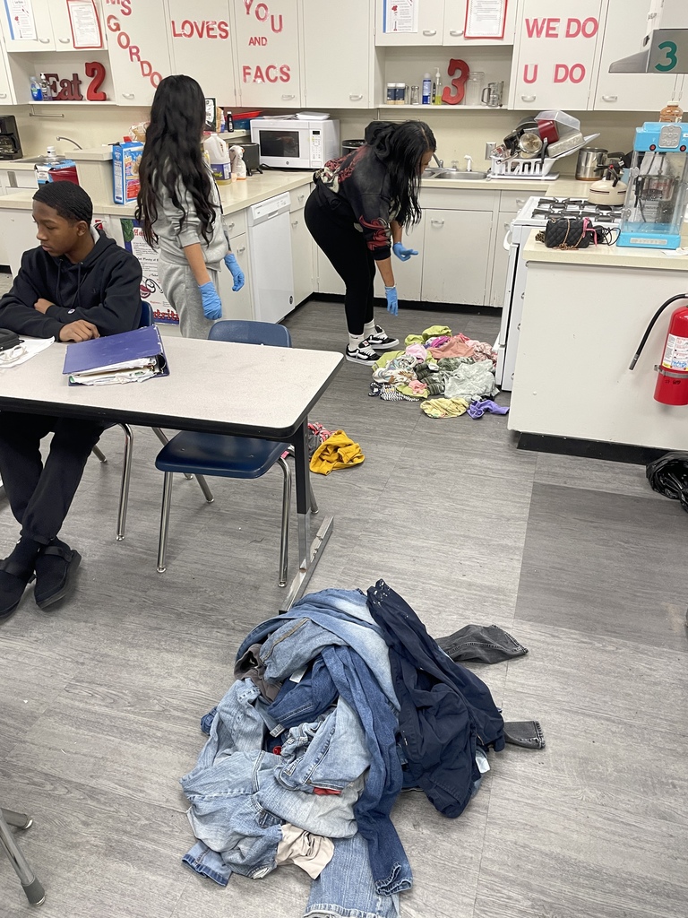 Family consumer science class cleaning clothes from service project 