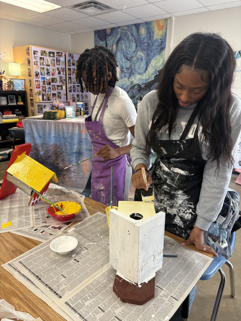 SHHS Students painting birdhouses for the community. 
