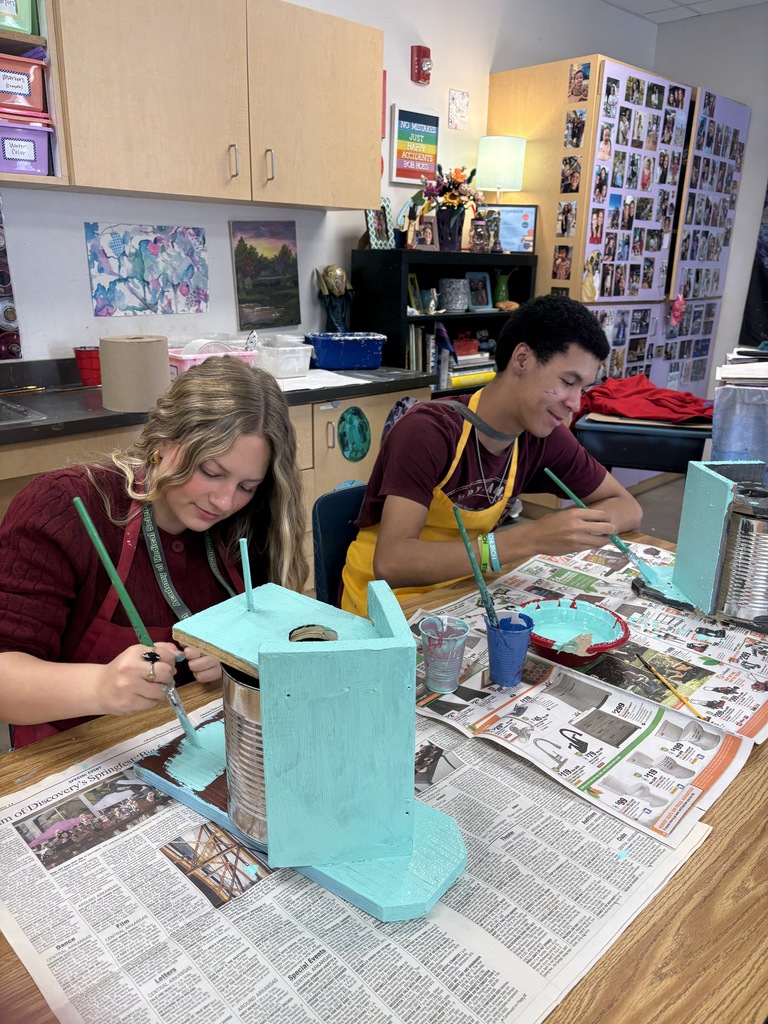SHHS Students painting birdhouses for the community. 