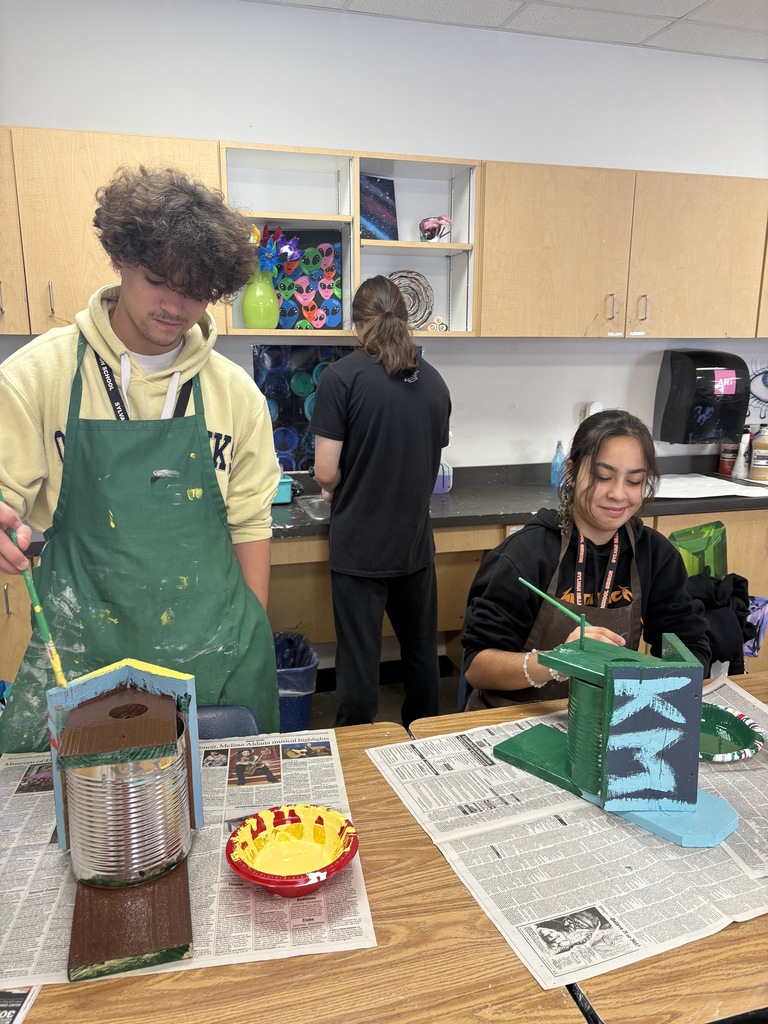 SHHS Students painting birdhouses for the community. 