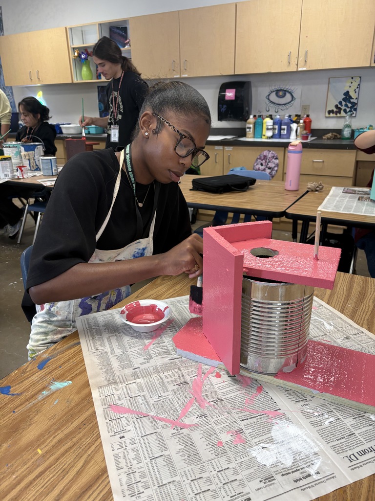 SHHS Students painting birdhouses for the community. 