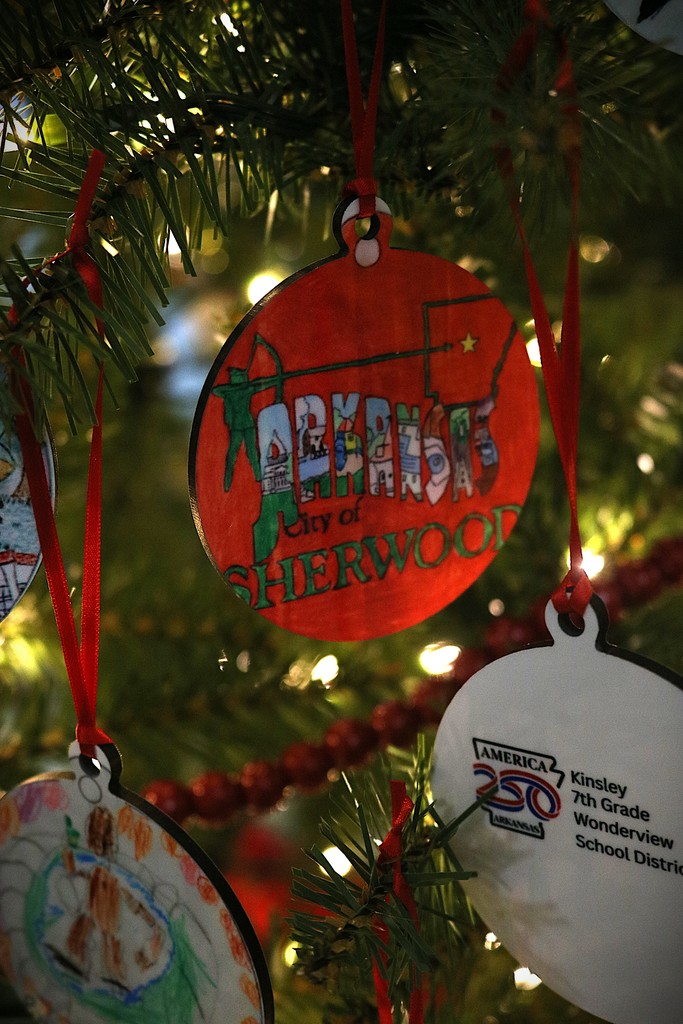 An ornament hanging from a Christmas tree. It says "Arkansas City of Sherwood"