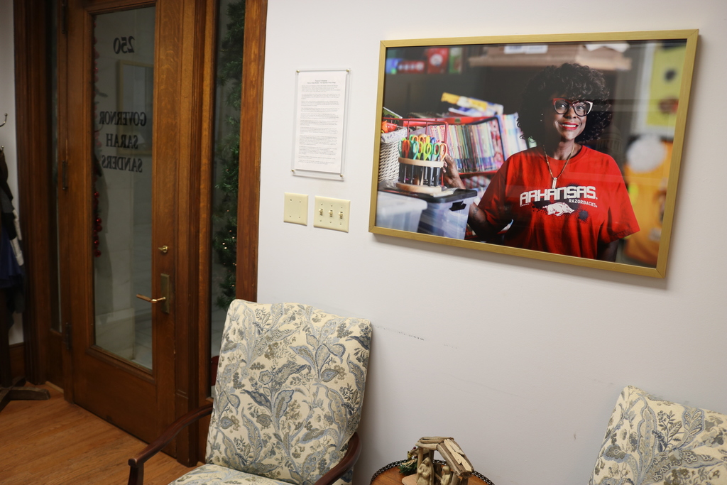 The interior of Governor of Arkansas' office at the Arkansas State Capitol. On the wall is a picture of MS. AB, a teacher at Sherwood Elementary