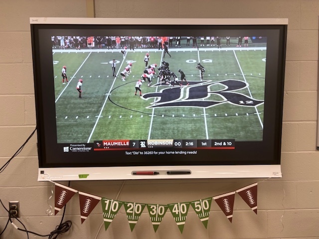 Students cheering on Robinson vs. Maumelle! 🏈💛🖤