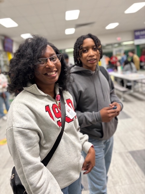 family smiling at Book Fair Family Night
