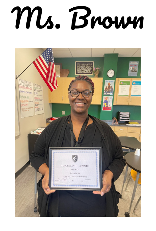 Teacher with framed certificate for teacher of the month