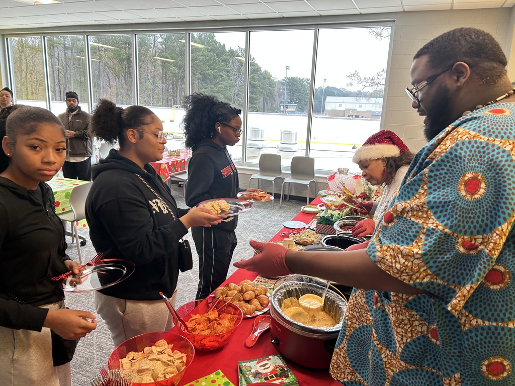 Teacher serving food to students