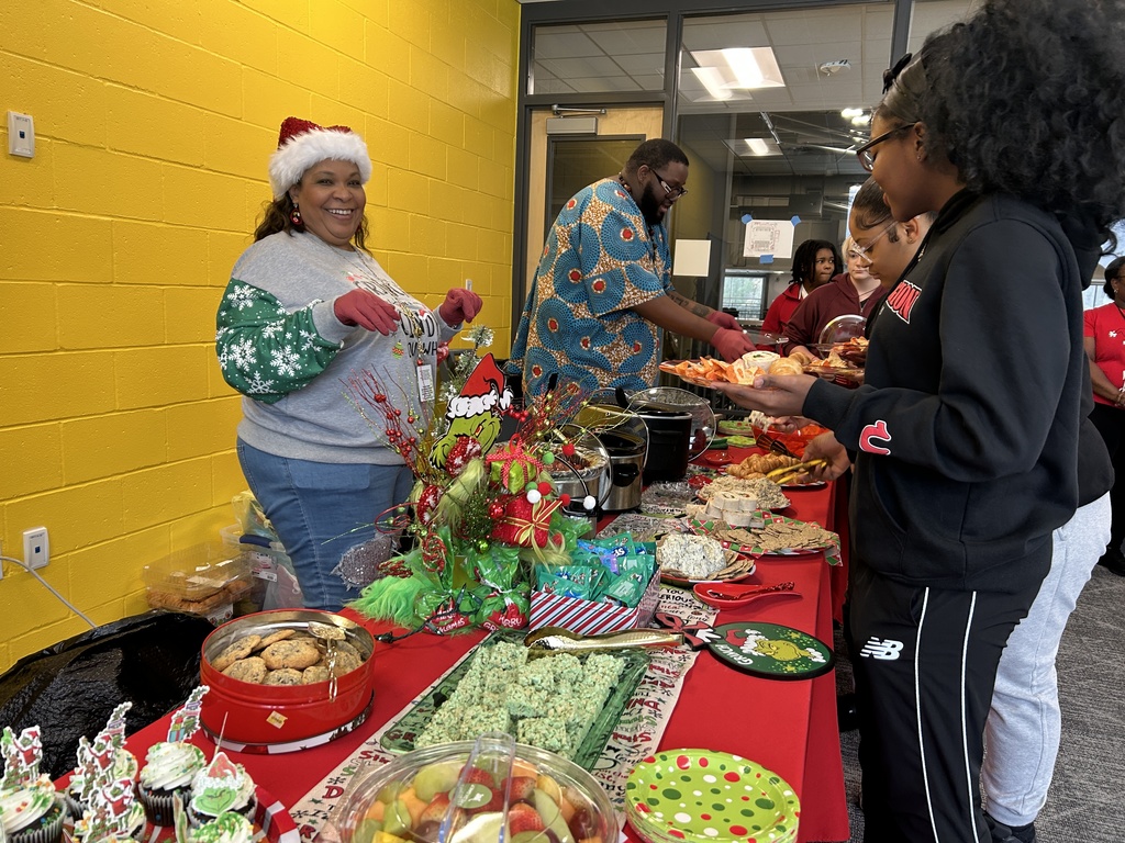 Teacher serving food to students