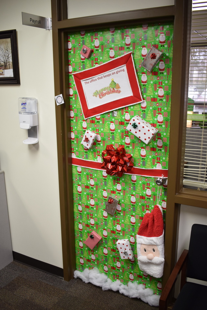 Holiday door decorated as a Christmas present