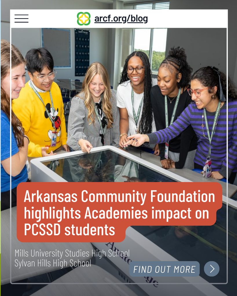 A picture of students pointing at an interactive table with text overlayed on top. It says "arcf.org/blog",  "Arkansas Community Foundation highlights Academies impact on PCSSD students",  "Mills University Studies High School Sylvan Hills High School", and "FIND OUT MORE"