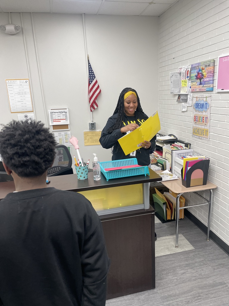 Woman with yellow folder smiling. 