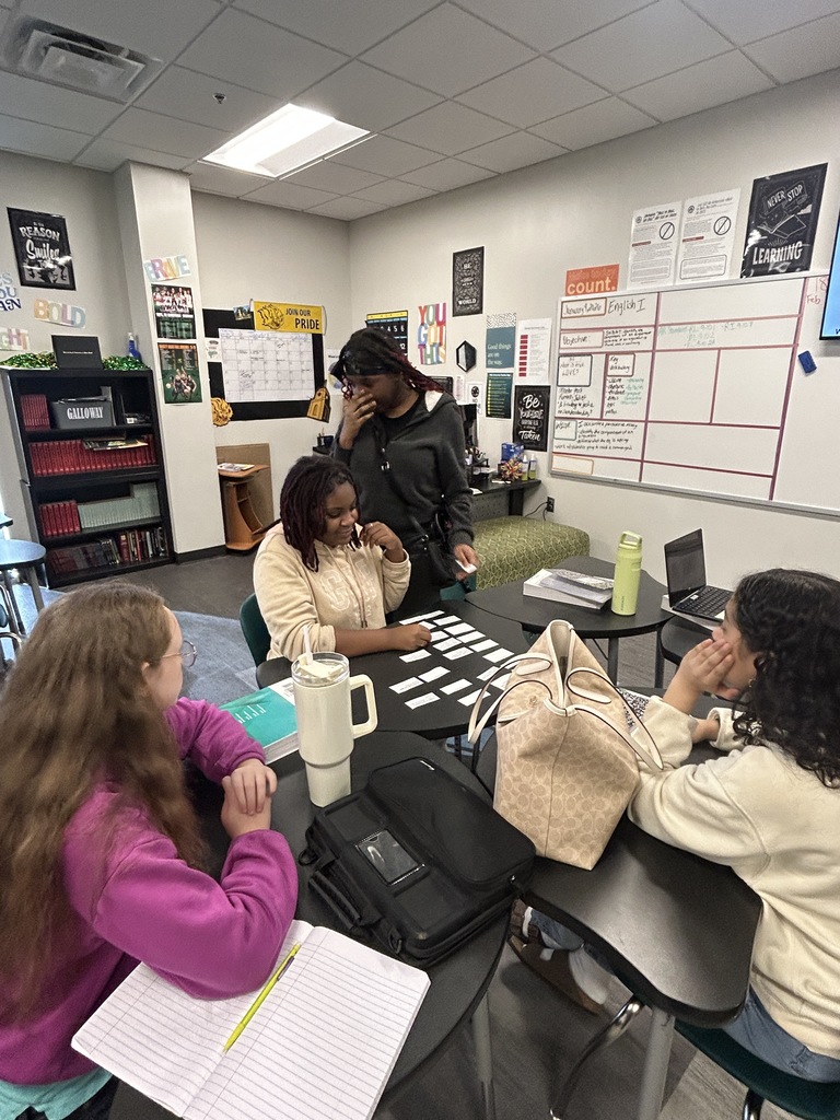 Students doing group work on desks