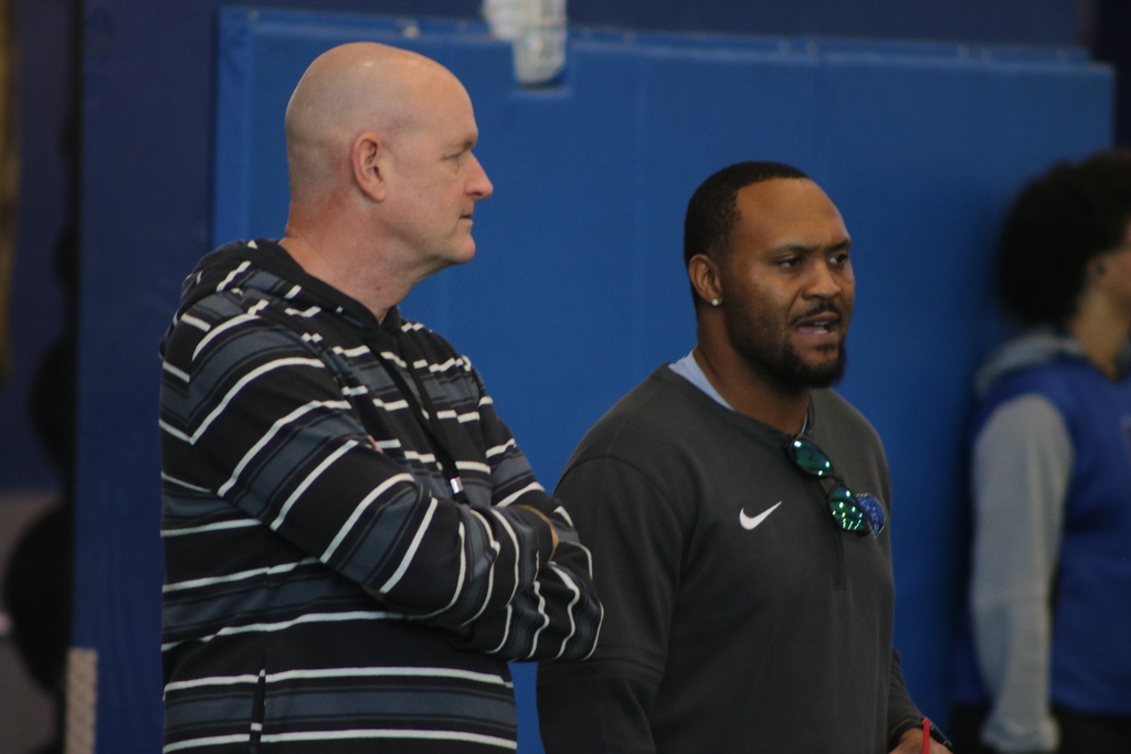 Principal Tracy Allen and coach Jarius Wright talking