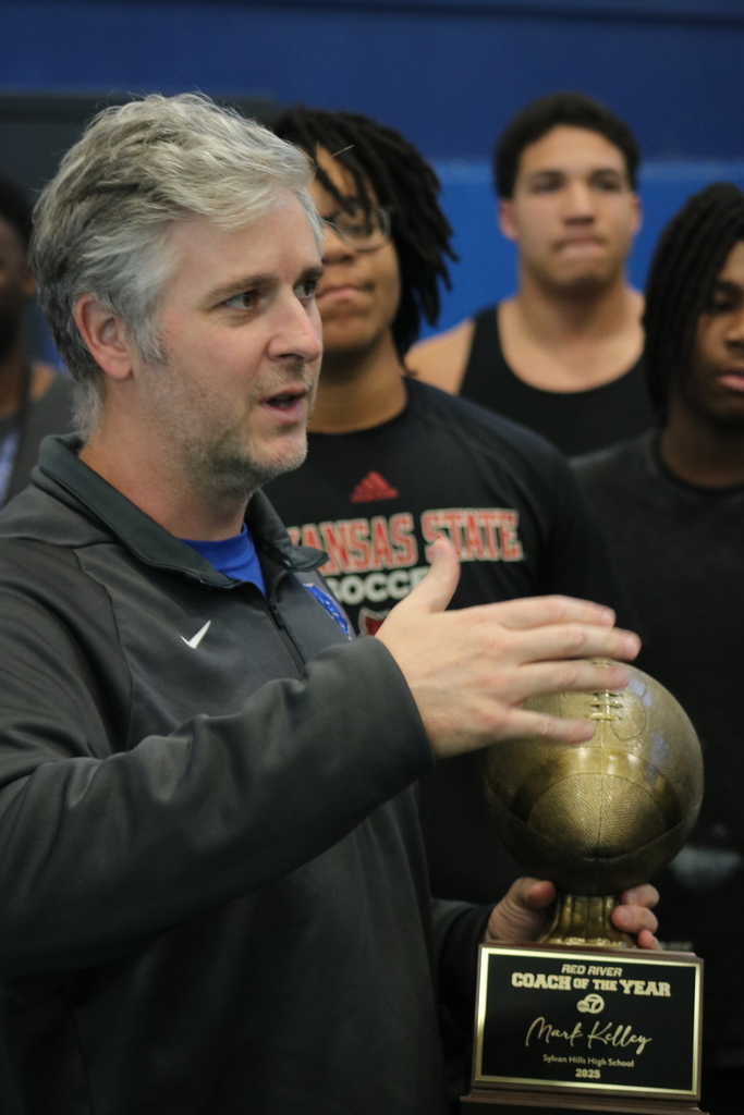Coach Kelley holds the 2025 Red River KATV Coach of the Year