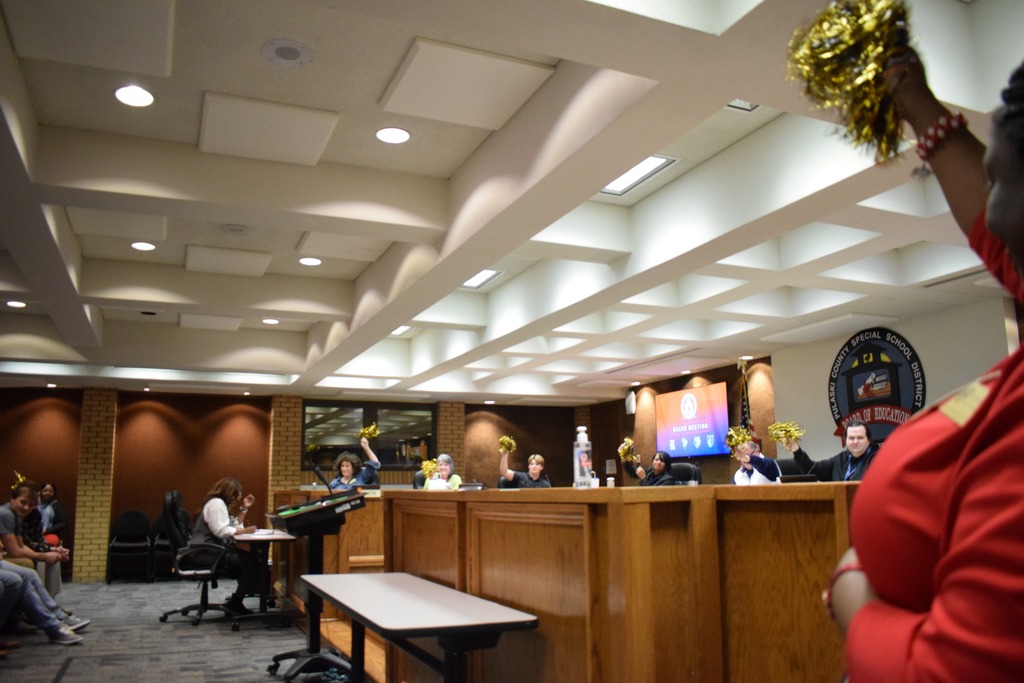 pom pom waived for the championship team in a board room