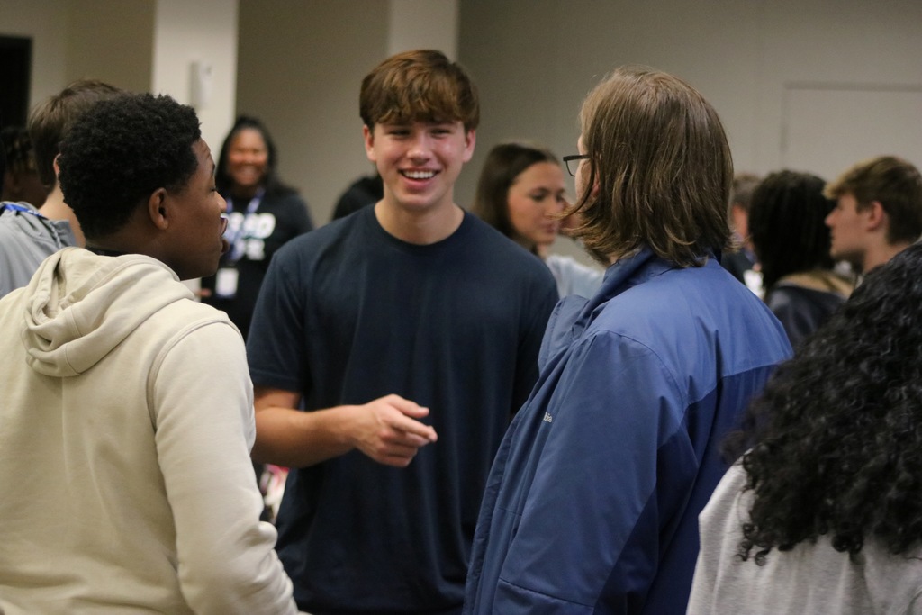 Students smiling while they talk to each other