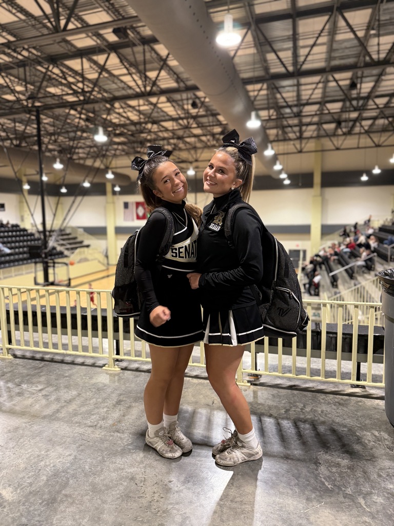 Two smiling cheerleaders